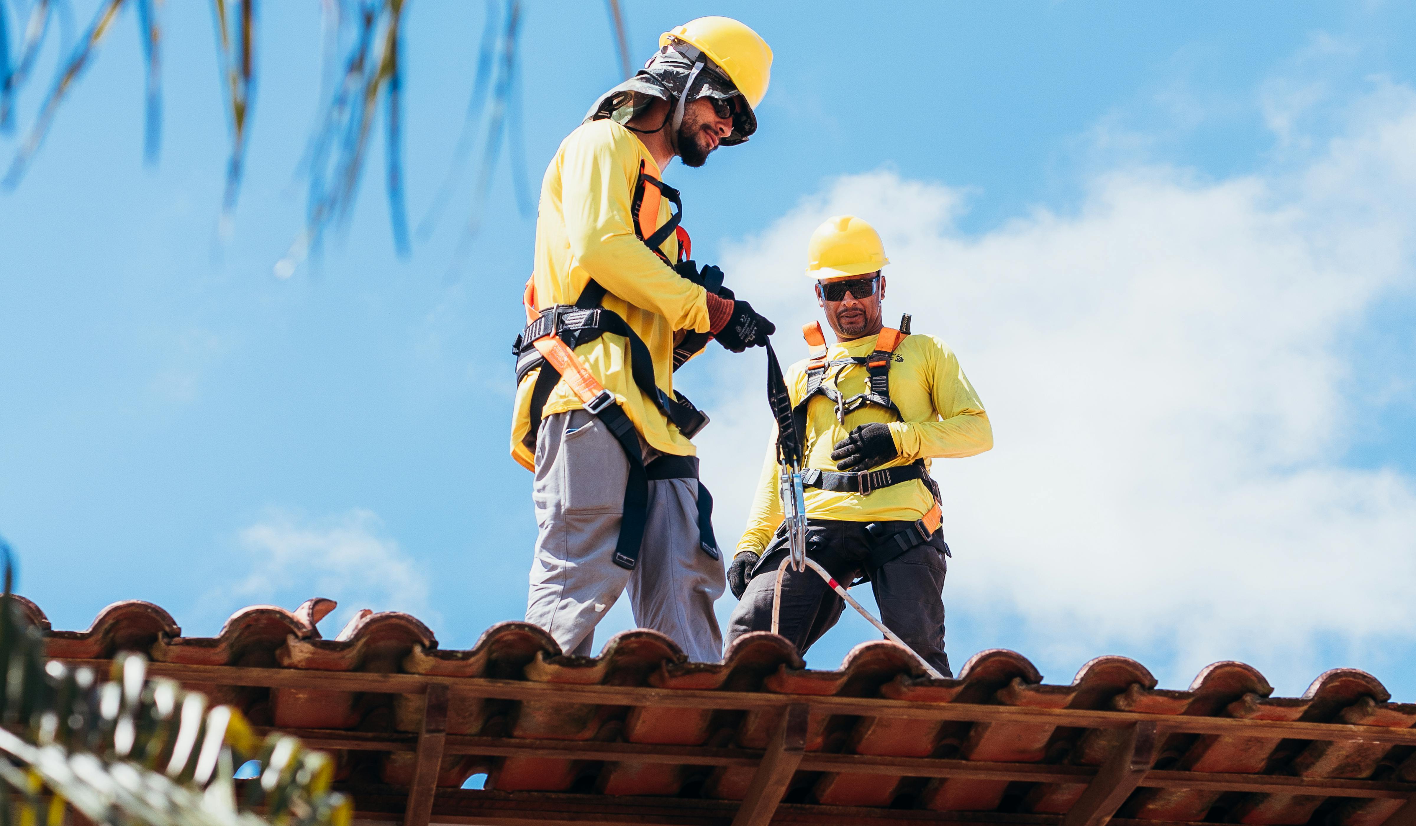 Roofing team conducting an on-roof inspection during a value modeling review.