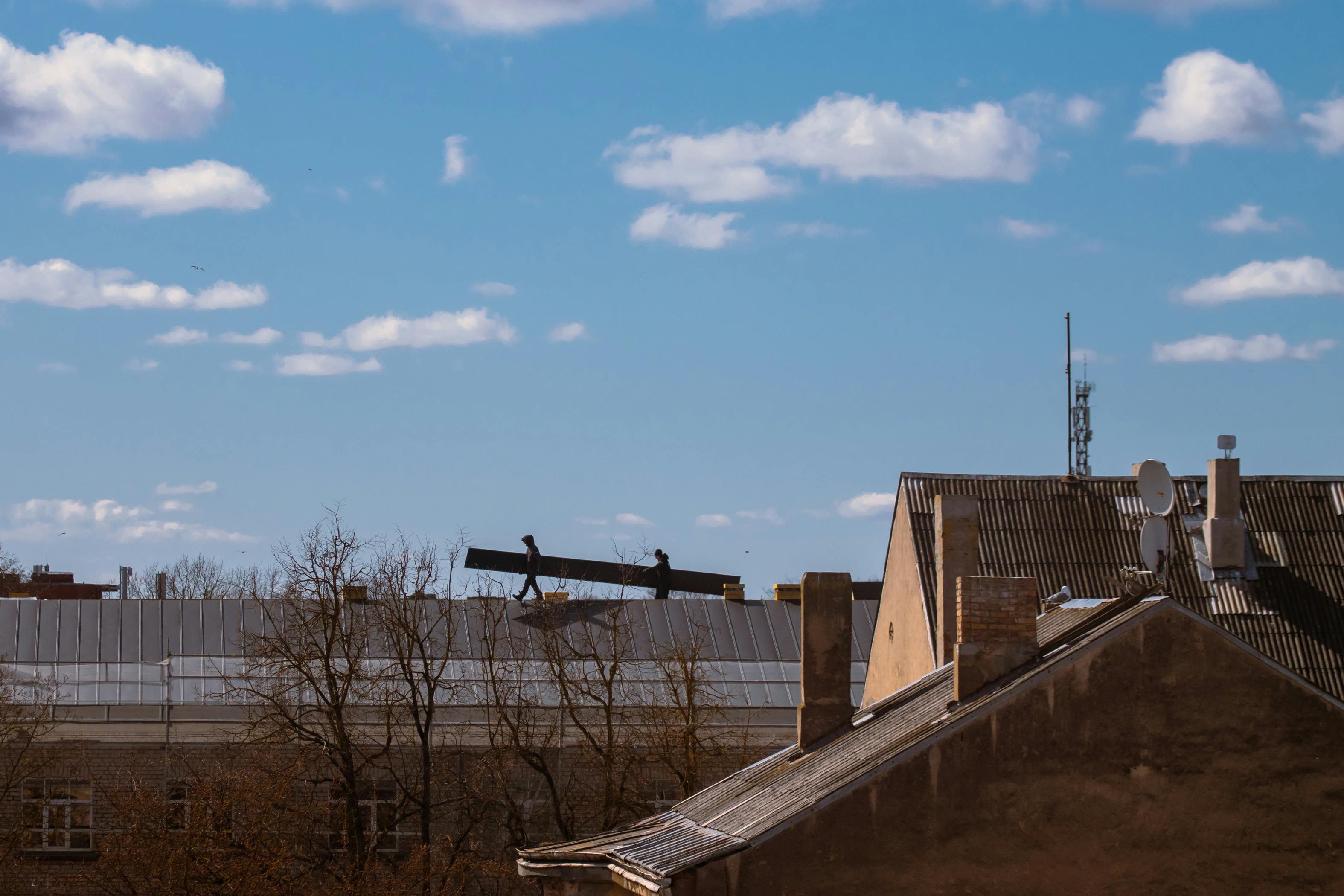 Commercial roofing team in active construction workflow.